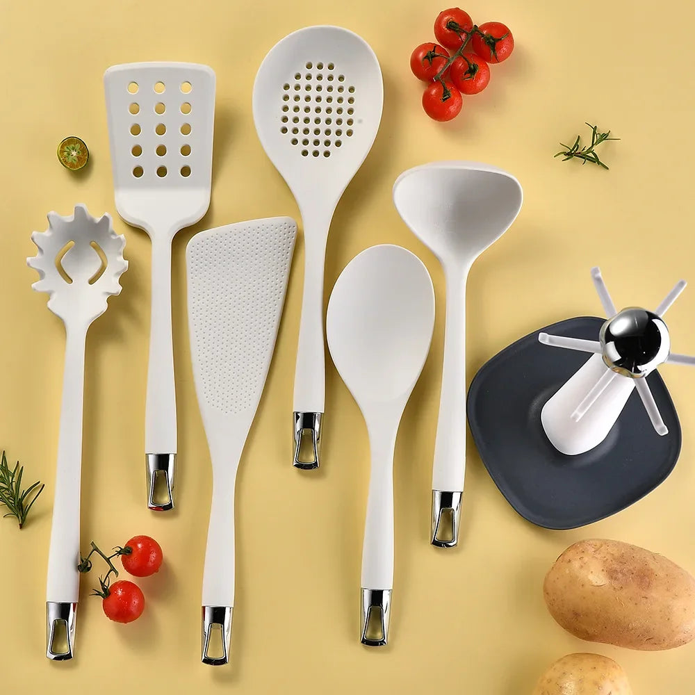 7-Piece Silicone Kitchen Utensils Set with 360° Rotating Countertop Holder – White silicone heads and handles with silver-tone stainless steel hanging hooks/end caps. Heat-Resistant, Dishwasher Safe